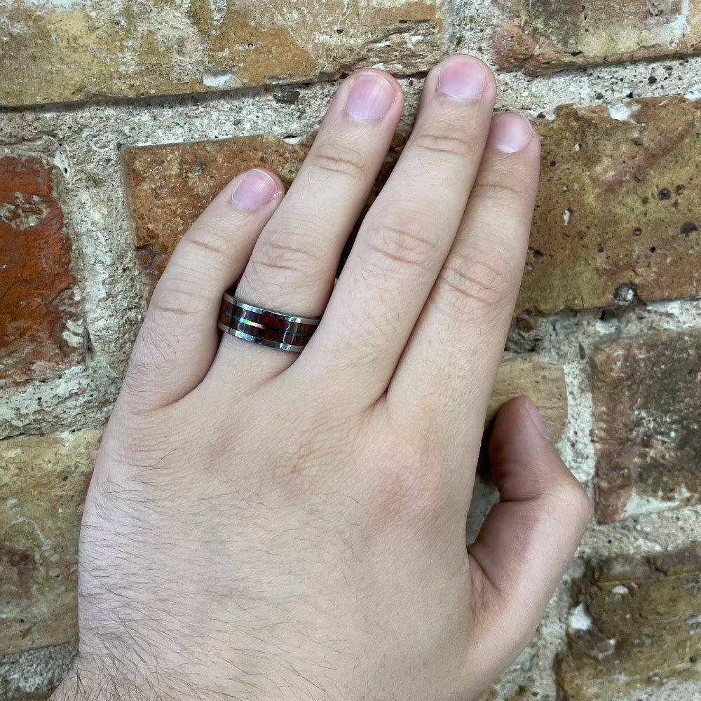 Men's 8mm Tungsten Band with Koa Wood and Abalone Inlay on hand