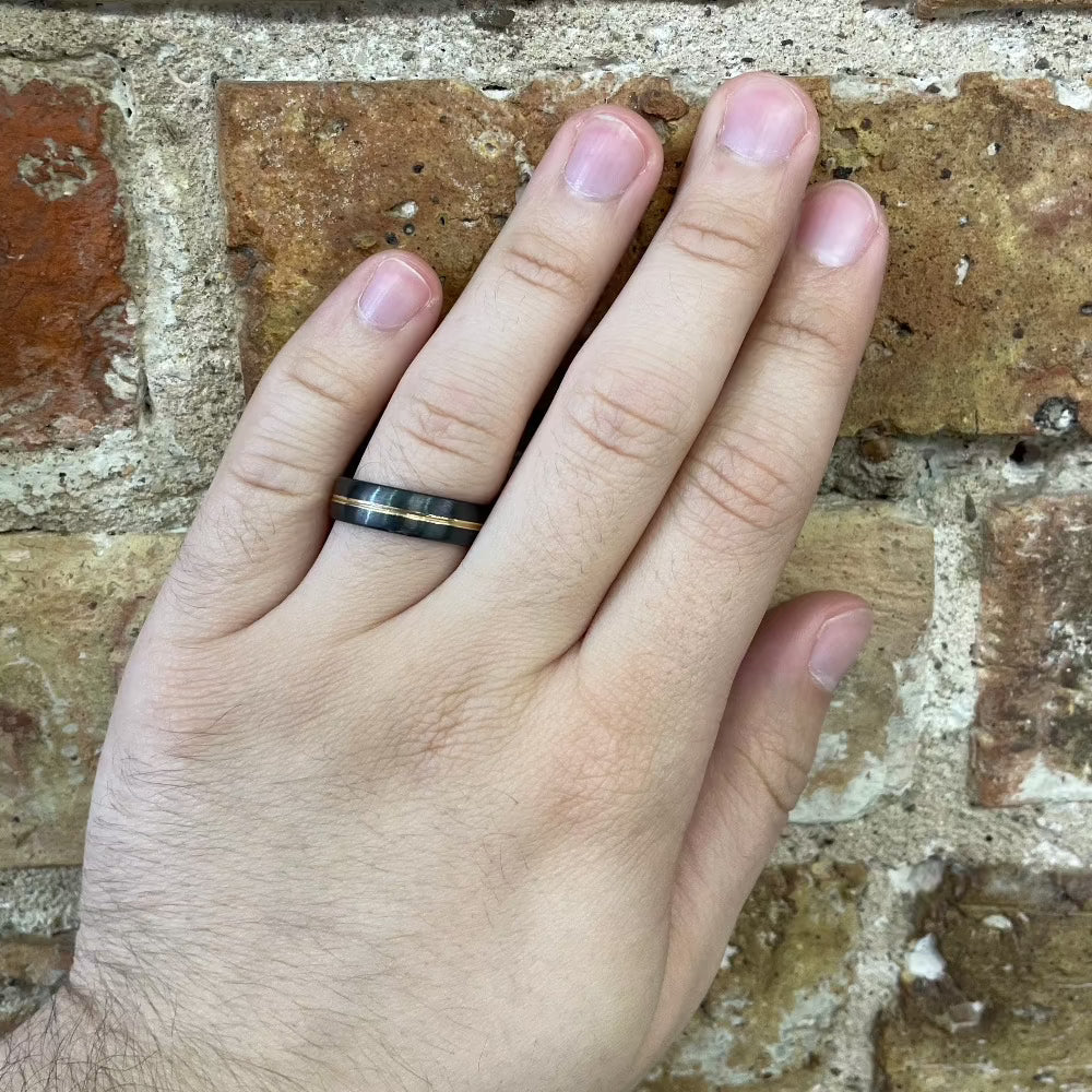 Men's 6mm Domed Black Zirconium Band with Gold Inlay on hand