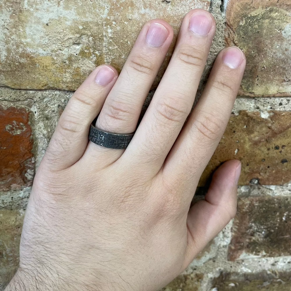 Men's 8mm Tungsten Galaxy Pattern Band with Cerakote Sleeve on hand