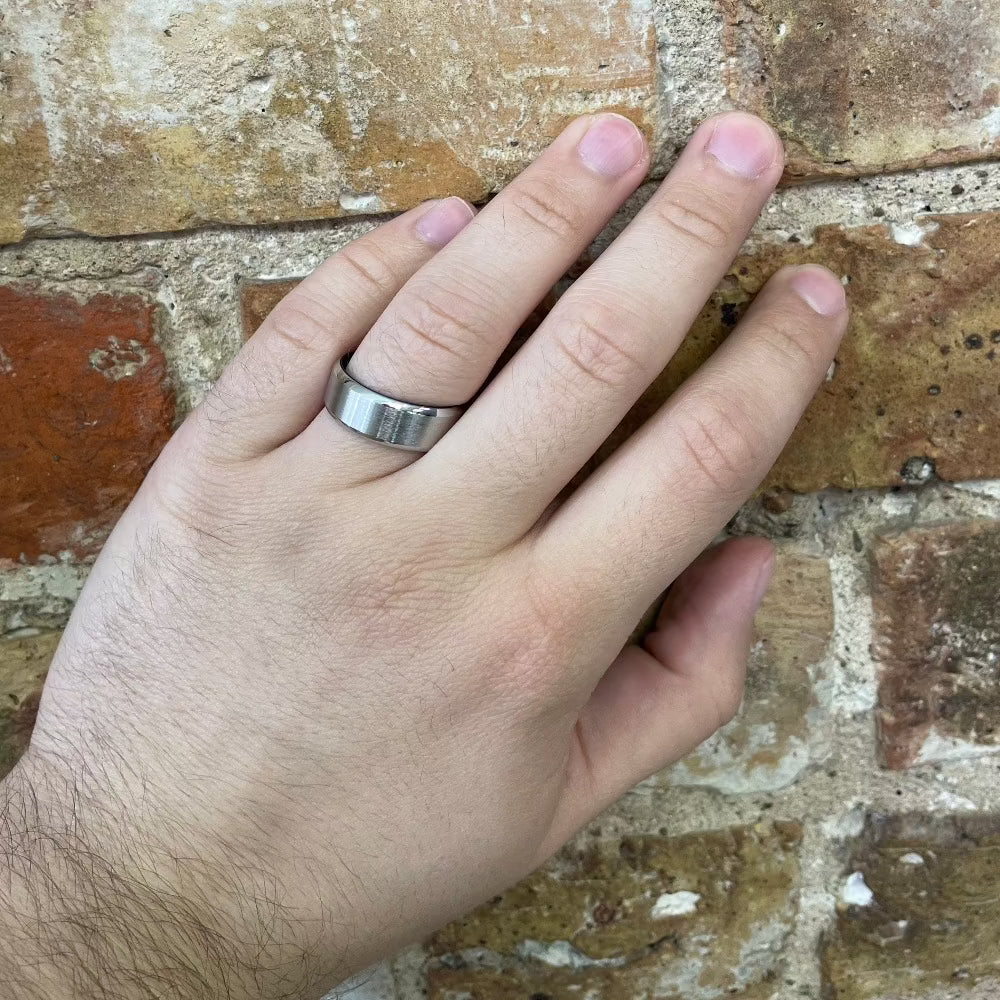 Men's 8mm Cobalt Chrome Band with Blue Anodized Sleeve on hand