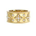 detail view of 14KY fleur-de-lis band with diamonds.