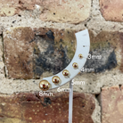 picture of all five sizes of gold ball earrings available with  labels.