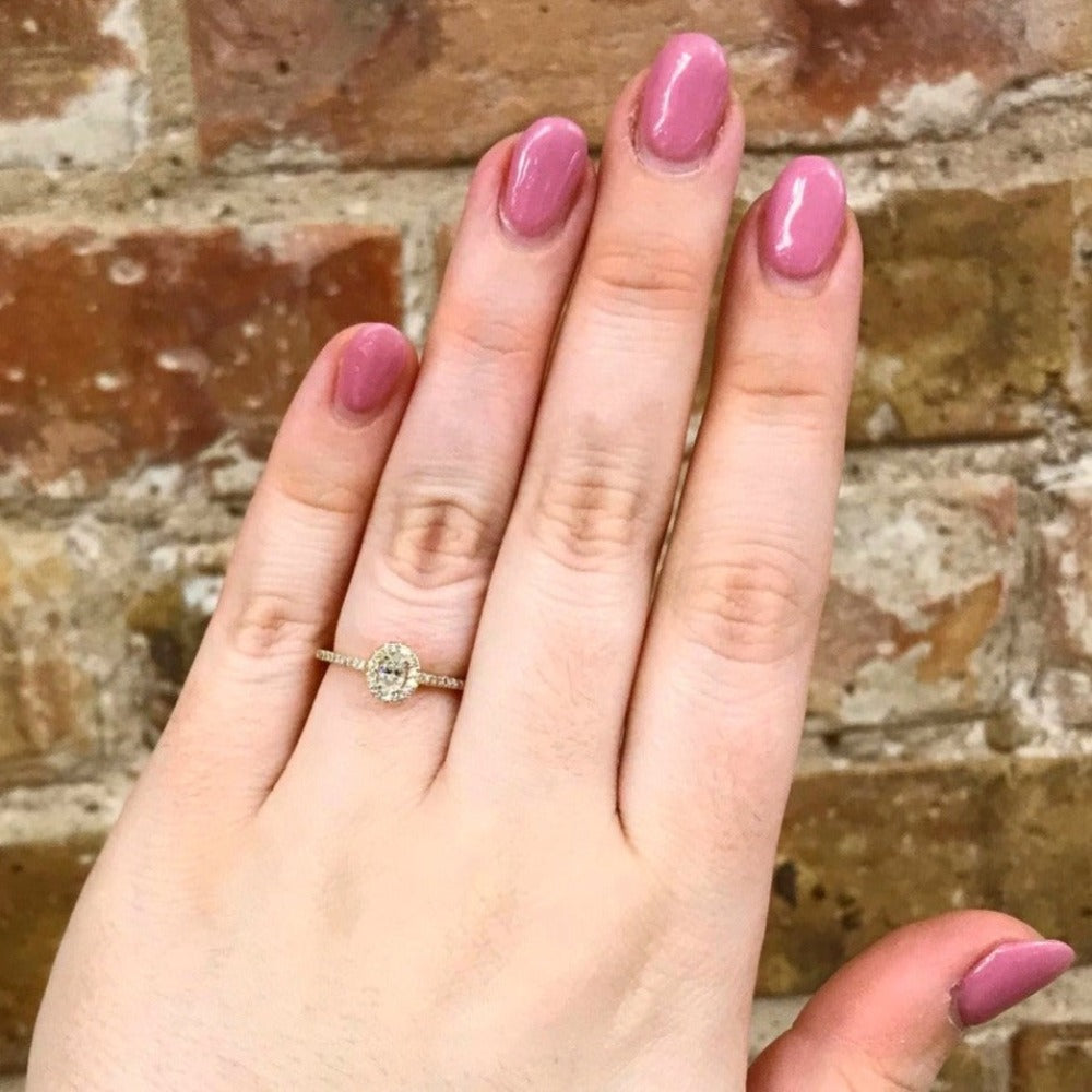 14KY Halo-Style Diamond Engagement Ring with Oval Center Stone On Model