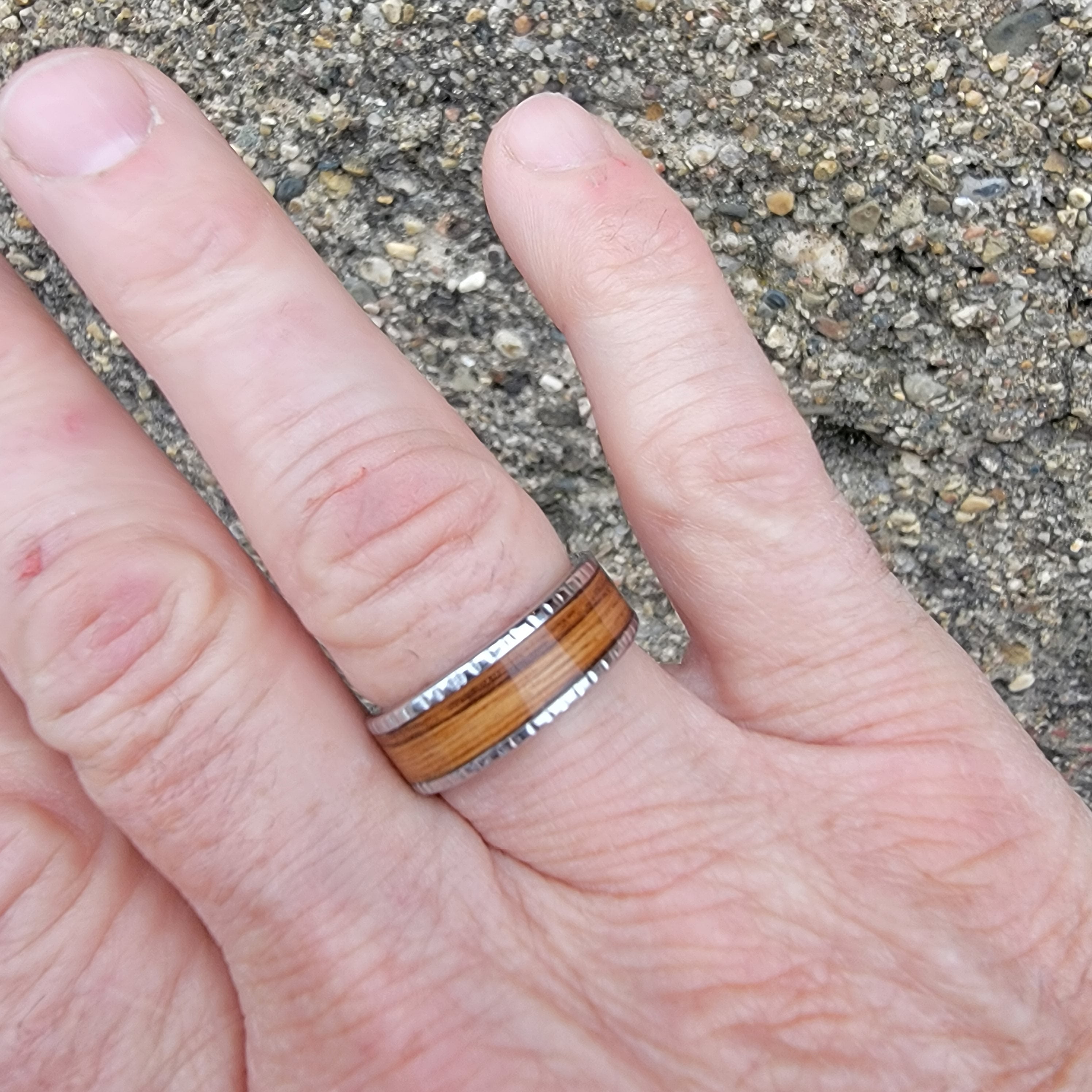 Serinium Men's Wedding Band with Rye Barrel Inlay on hand 1