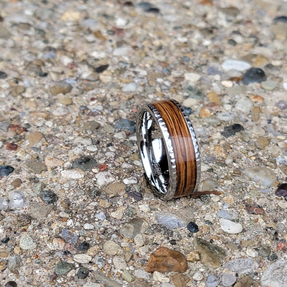 Serinium Men's Wedding Band with Rye Barrel Inlay on concrete