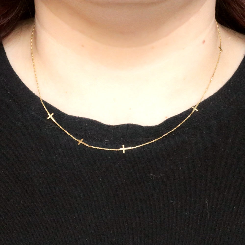 Gold Sideways Station Crosses Necklace on model