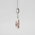 Sterling Silver & CZ Two-Toned Rhythm of Love Fleur-de-Lis Drop Pendant from the side