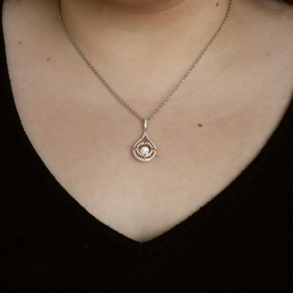 Sterling Silver & CZ Two-Toned Rhythm of Love Fleur-de-Lis Drop Pendant on model