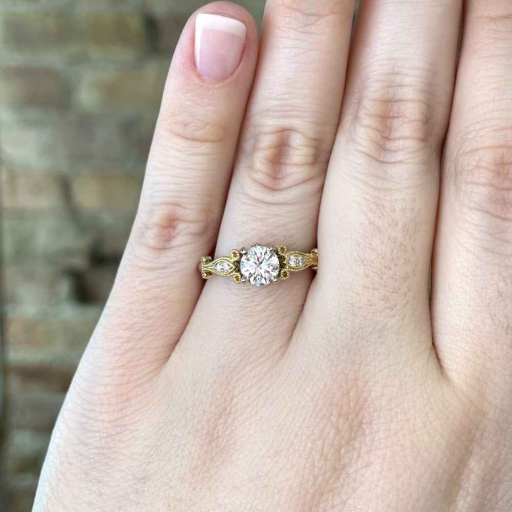 view of 14k two toned engagement ring on model