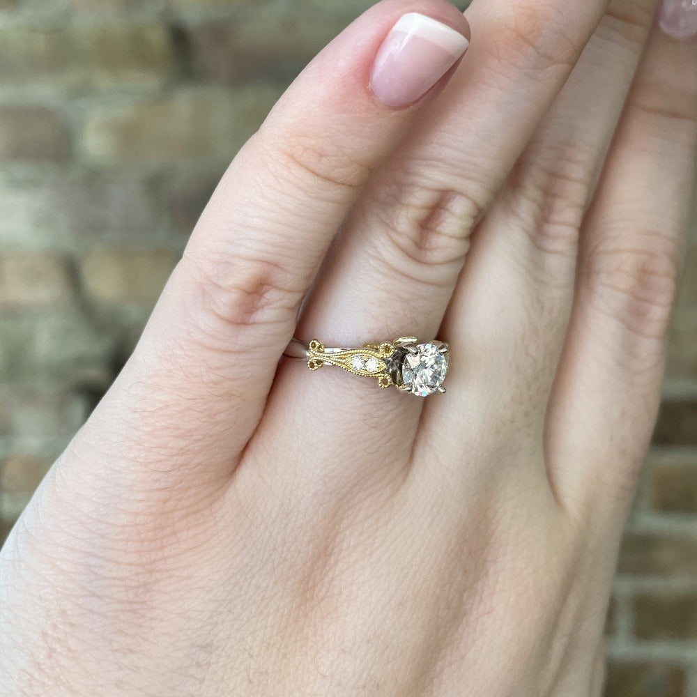 view of side details of 14k two toned engagement ring