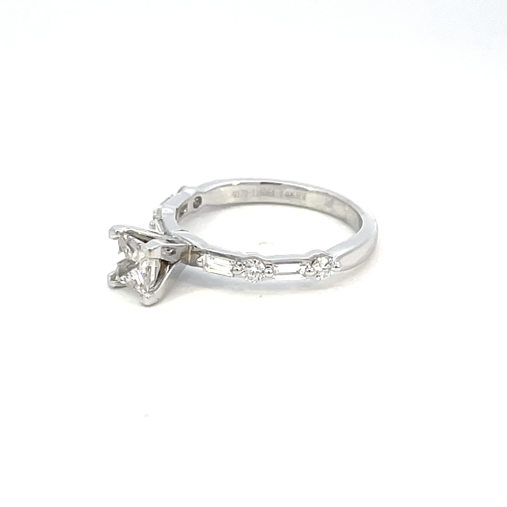 side view of 14kw princess cut diamond solitaire engagement ring with round and baguette accents