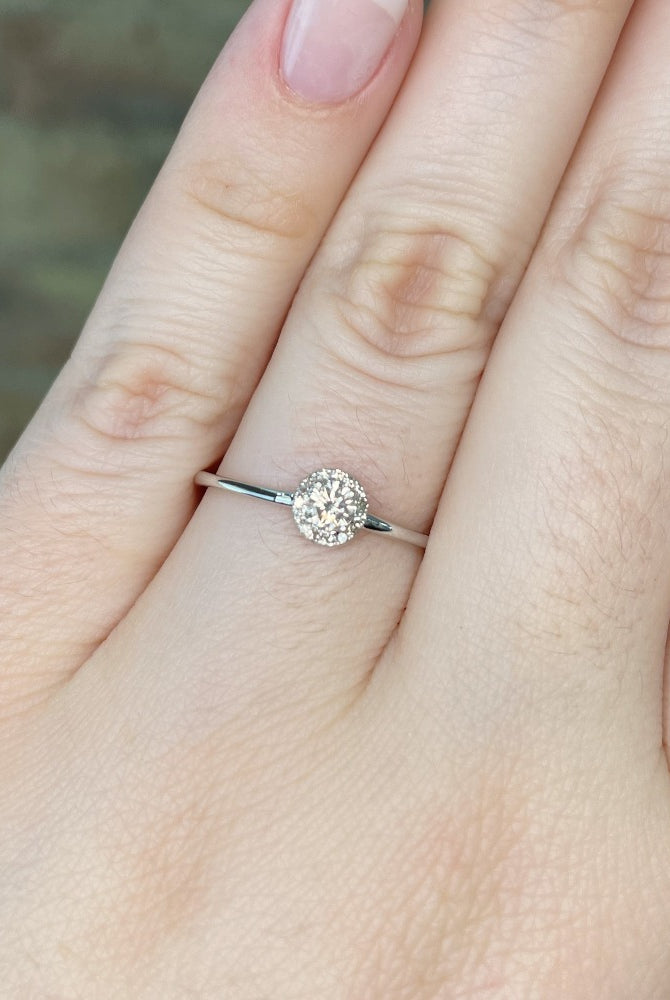 10kw round halo style engagement ring on model