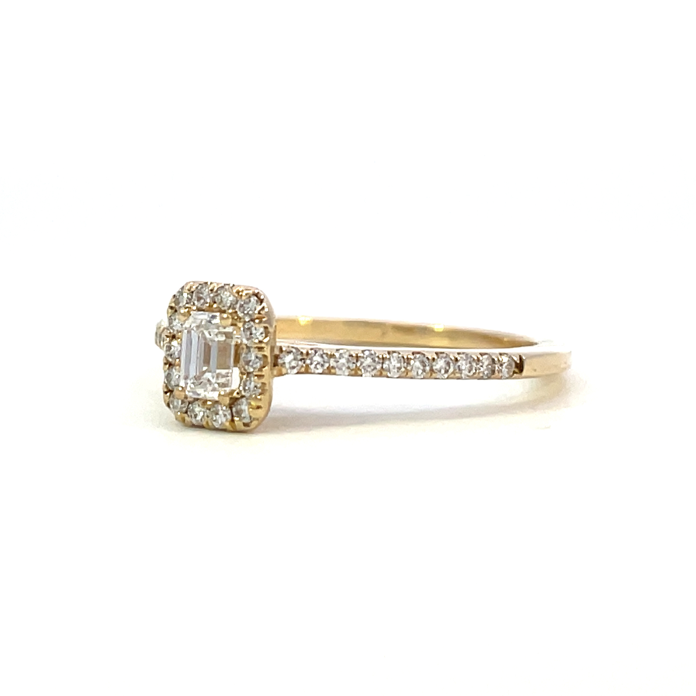 side view of 14ky emerald cut halo-style engagement ring.