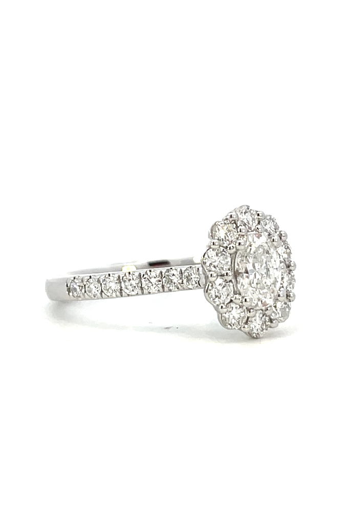side view of oval lab grown diamond halo style engagement ring.