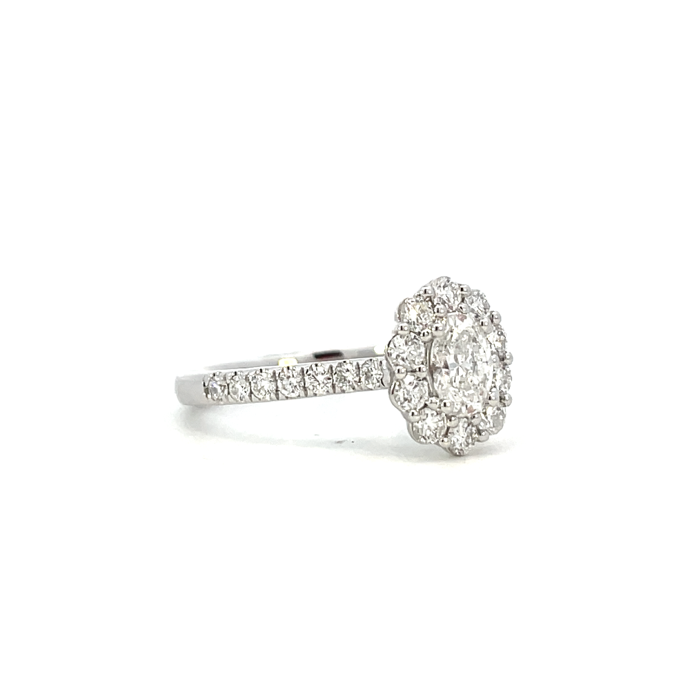 side view of oval lab grown diamond halo style engagement ring.