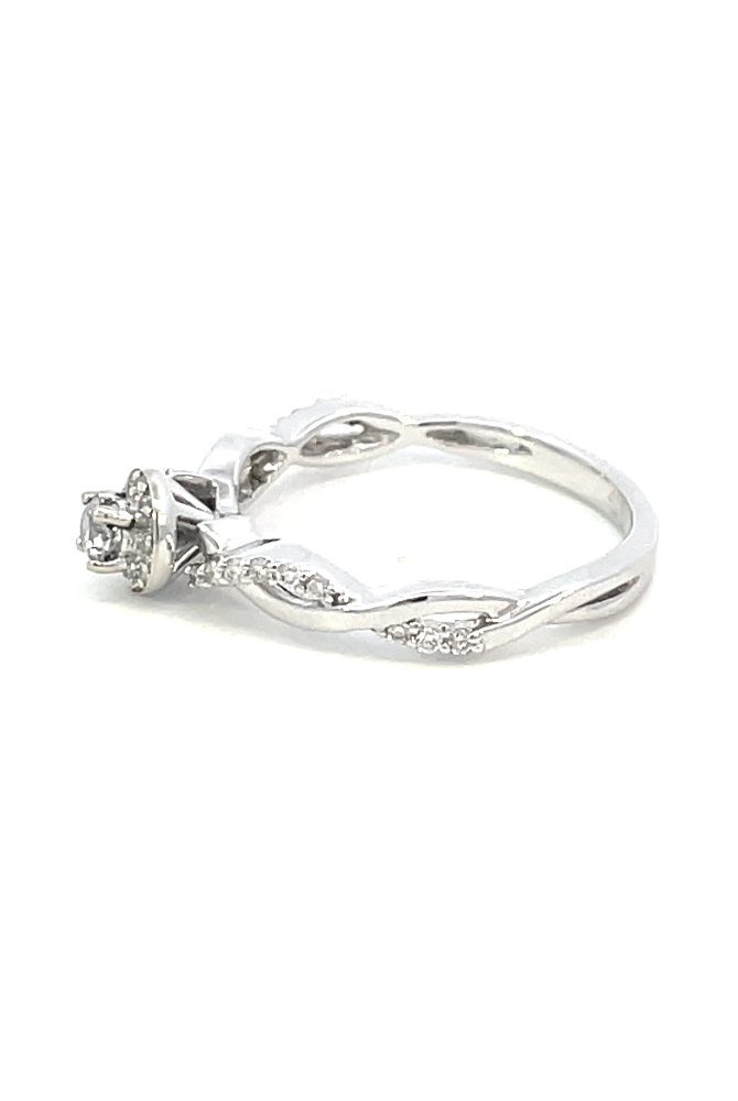 side profile view of 10kw round halo style engagement ring with twisted shank.