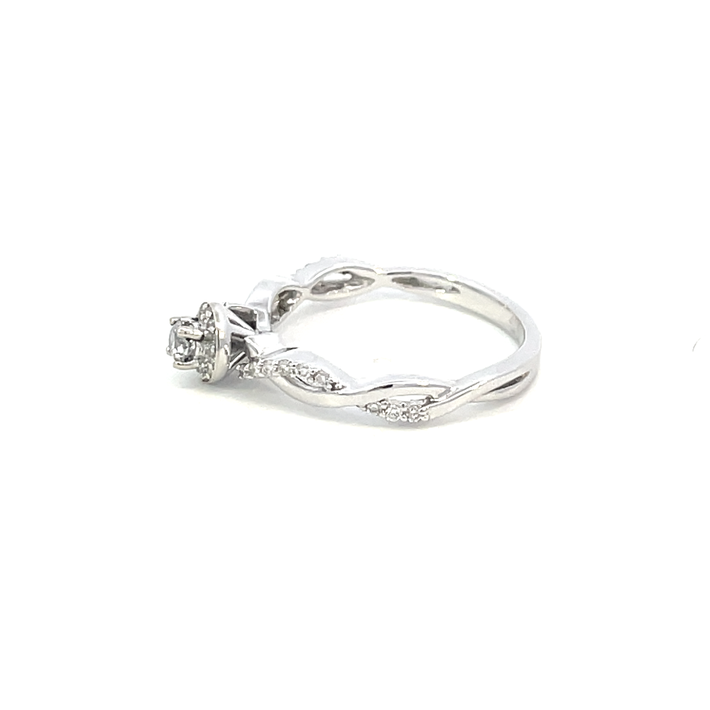 side profile view of 10kw round halo style engagement ring with twisted shank.