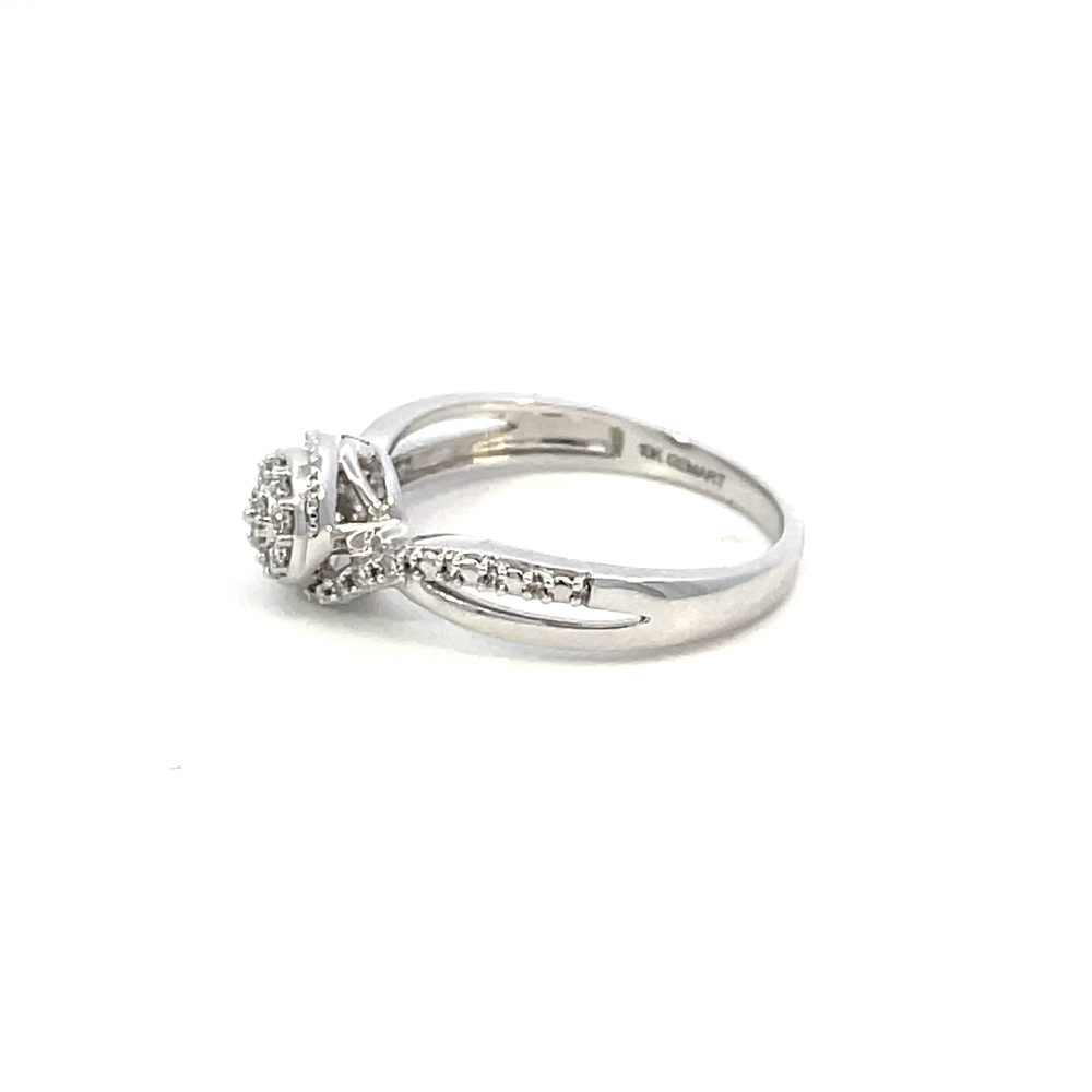 side profile view of 10kw cluster diamond engagement ring with twist shank.