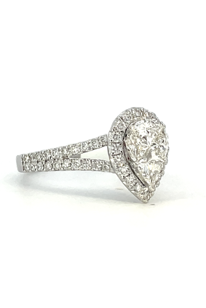 side view of 14kw pear shaped halo style engagement ring with split shank