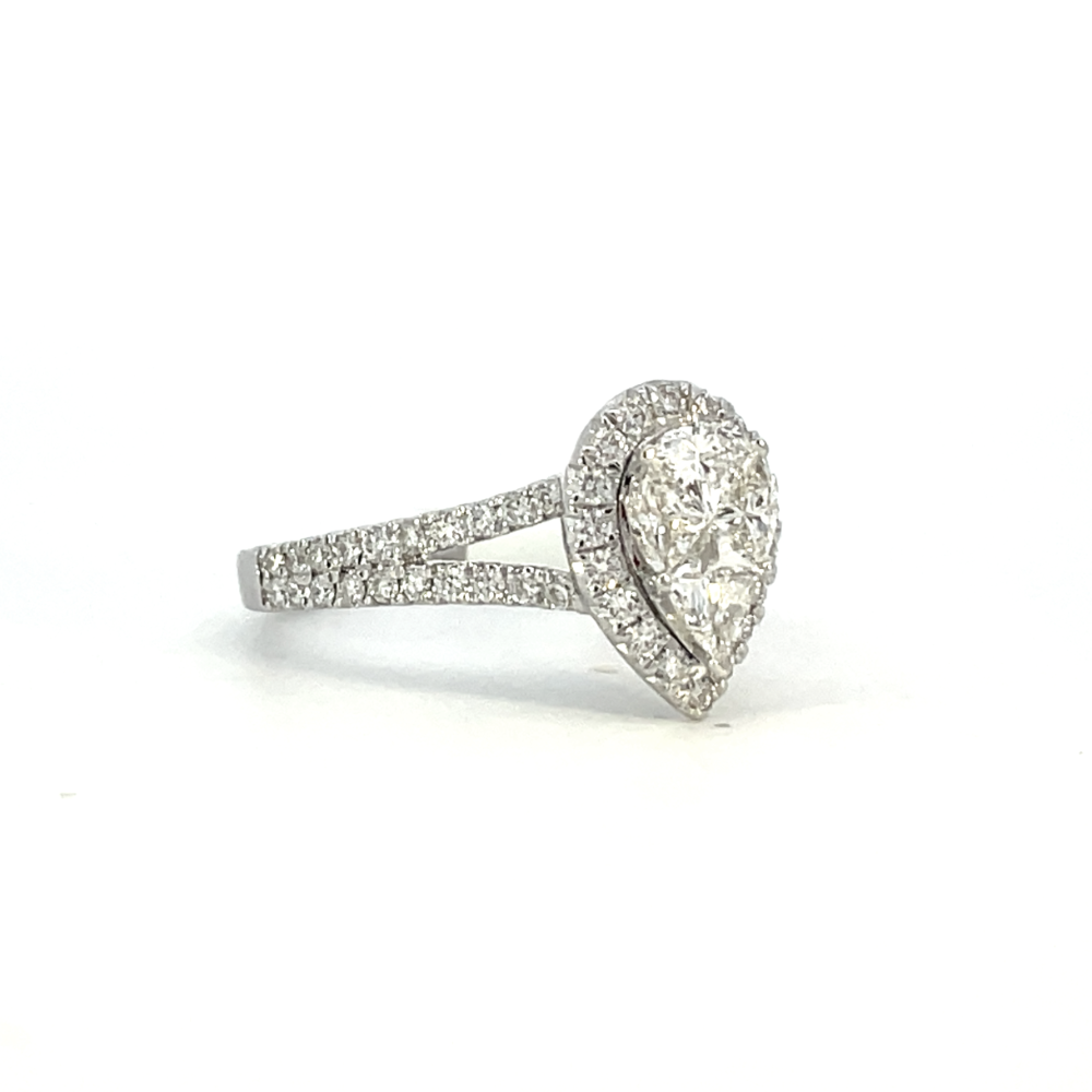 side view of 14kw pear shaped halo style engagement ring with split shank