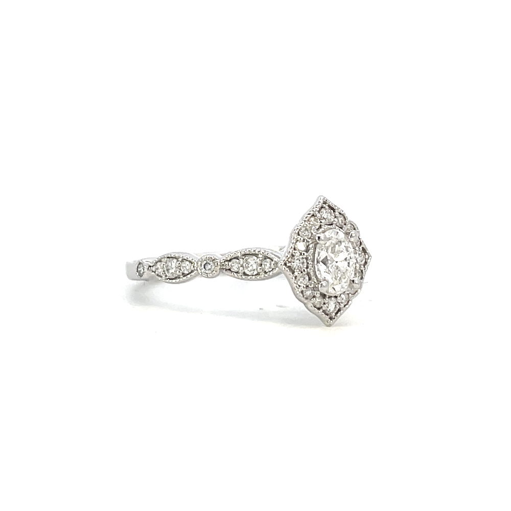 side view of vintage inspired halo style engagement ring with oval center stone