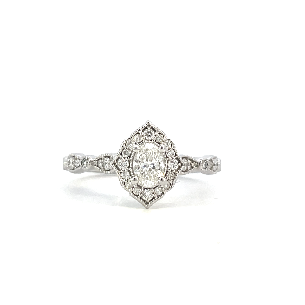 front view of vintage inspired halo engagement ring with oval center stone.
