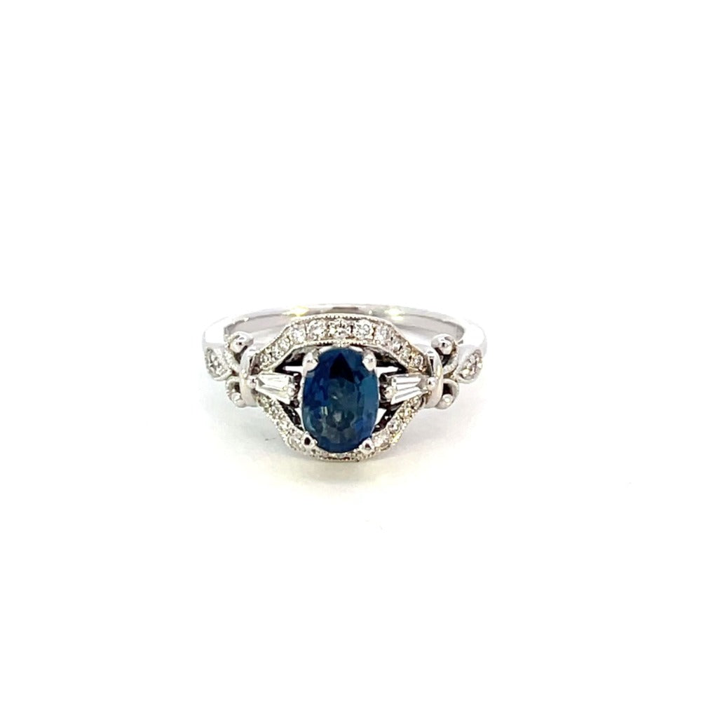 front on view of sapphire and diamond engagement ring with antique style mounting.