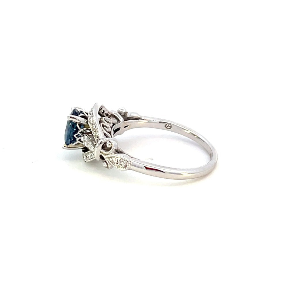 side view of vintage inspired sapphire and diamond engagement ring. photo shows manufacturer stamp.