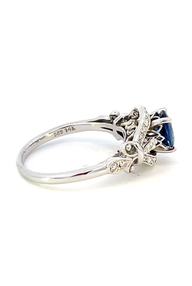side view of vintage inspired sapphire and diamond engagement ring. photo shows 14k stamp on inside of band.