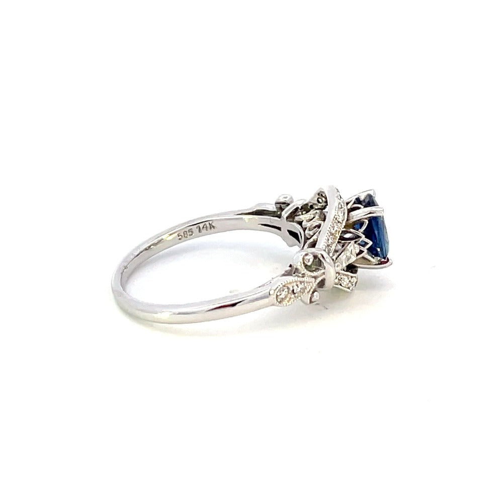 side view of vintage inspired sapphire and diamond engagement ring. photo shows 14k stamp on inside of band.