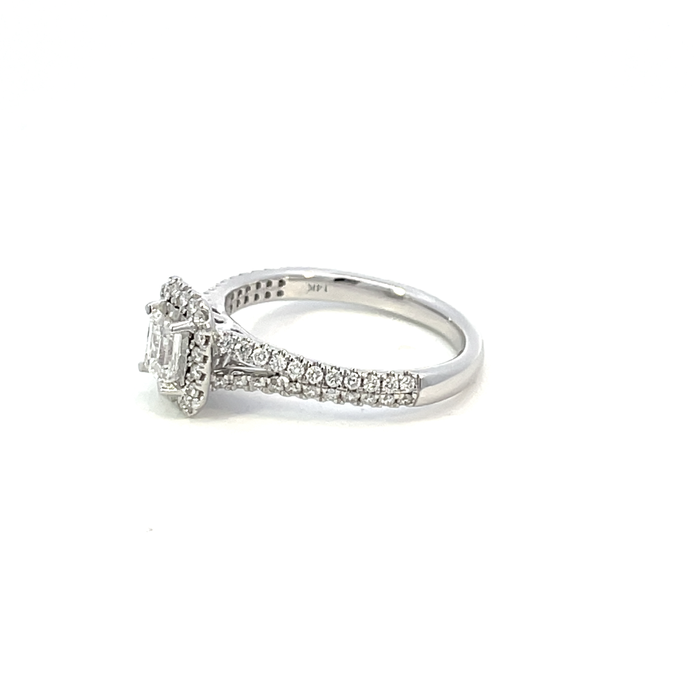 side view of 14kw emerald cut halo style engagement ring with split shank.