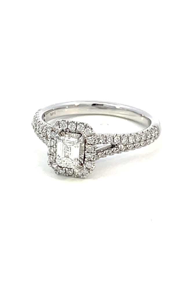 side angle view of 14kw emerald cut diamond halo style engagement ring with split shank