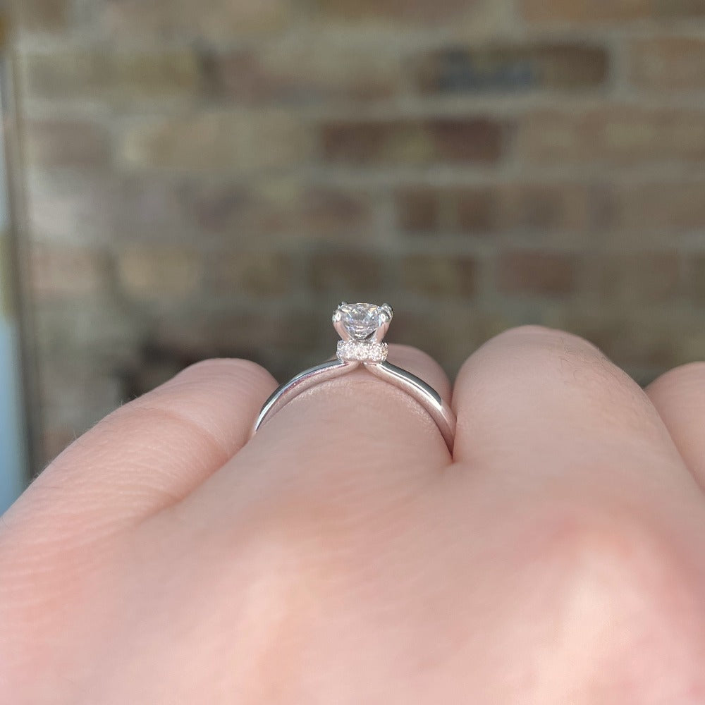 side view of 14kw SallyK accented solitaire engagement ring. View shows the ring's hidden halo.