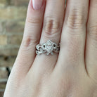 14kw floral inspired wedding set with marquise cut center stone on model.