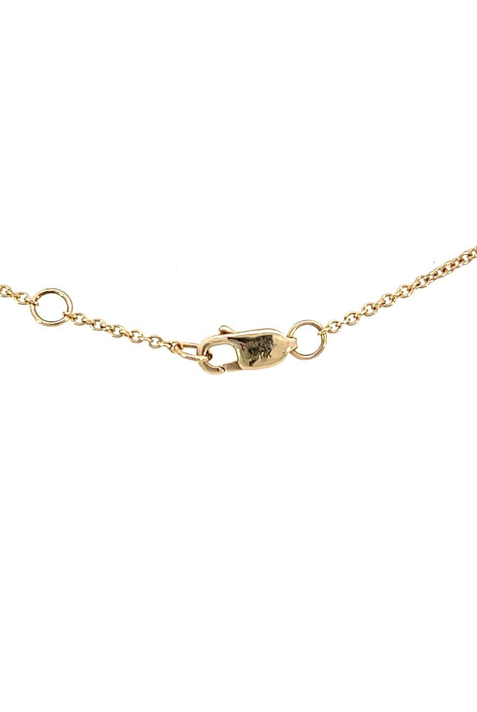 view of the lobster clasp and adjustable chain on the 14k two-toned gold anklet.
