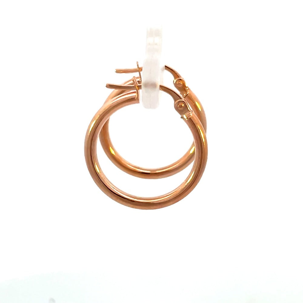 Side view of 15mm 14k rose gold hoop earrings that shows the side of the hoop and the closure.