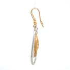 side view of 14k two toned gold earrings with pear shaped drops and French wires