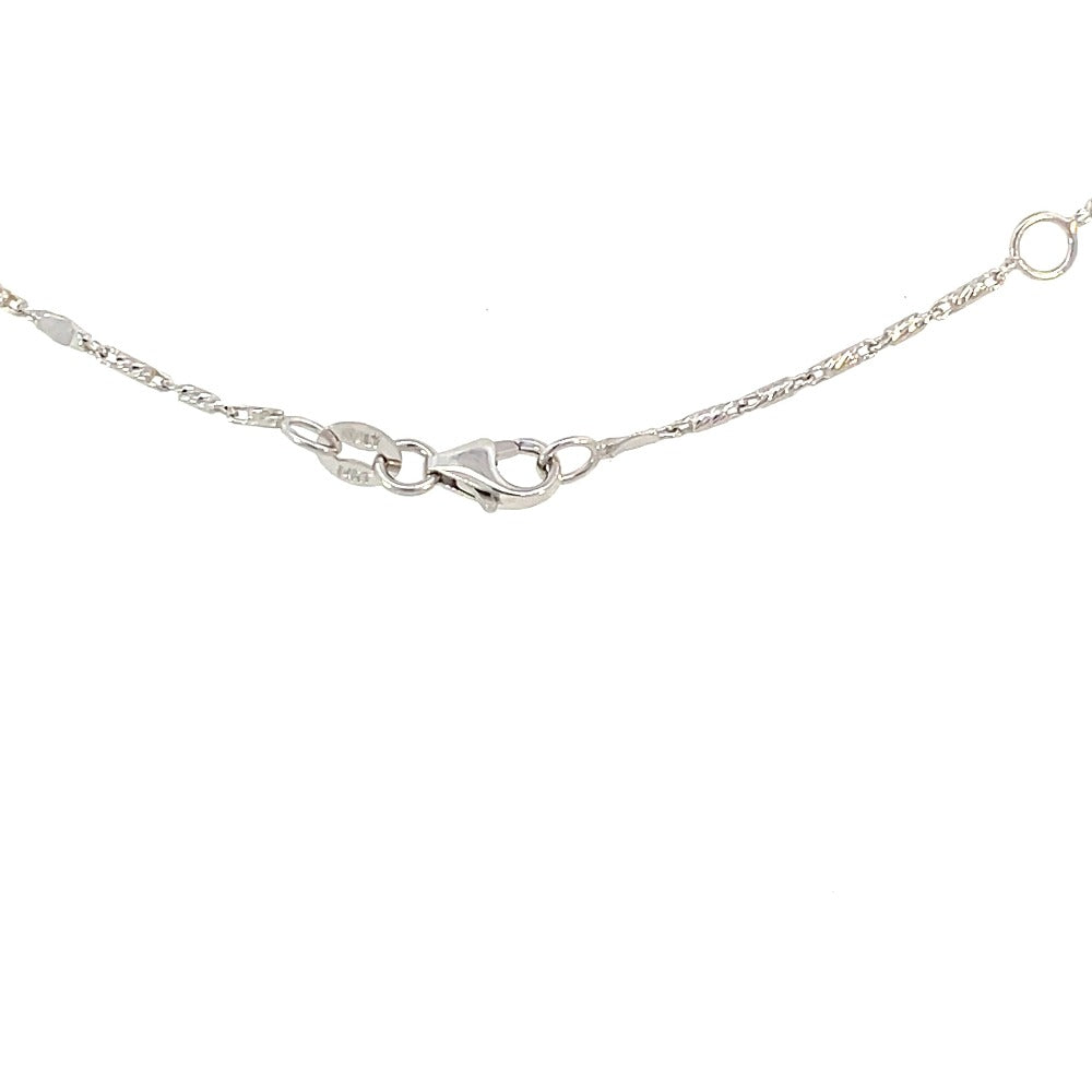 back view of 14k white gold anklet that shows the lobster clasp, karat stamp and extra jump ring for length adjustment
