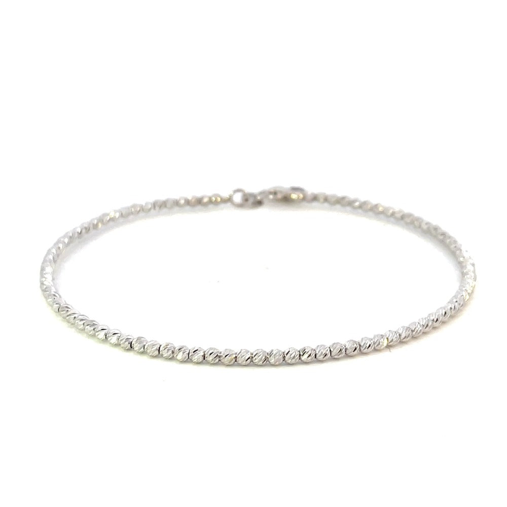 front view of 14k white gold beaded bracelet with diamond cutting on the beads