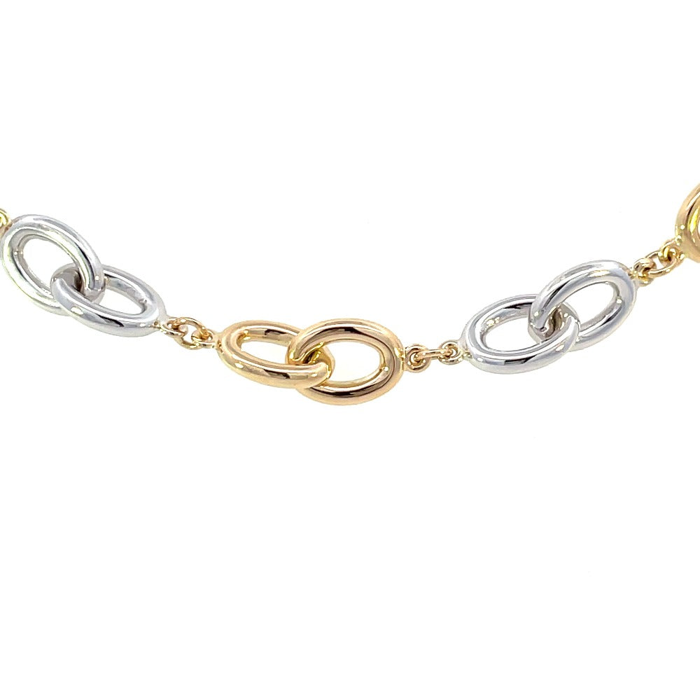 detail view of links on 14k two toned gold oval link bracelet