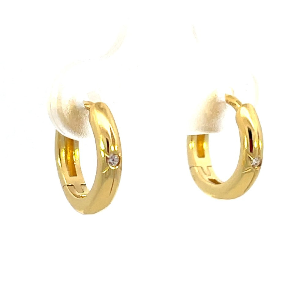 Ania Haie Sterling Silver Star Huggie Hoop Earrings with Gold Overlay side one