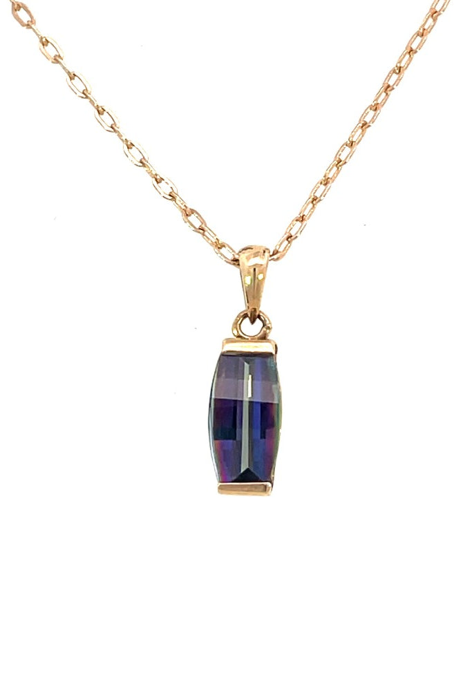 detail view of domed barrel cut mystic topaz pendant set in 14 karat yellow gold on a cable chain