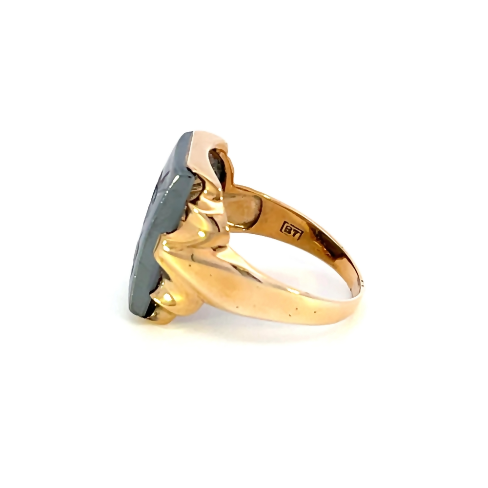 side view of gents 10k yellow gold ring with carved black stone center