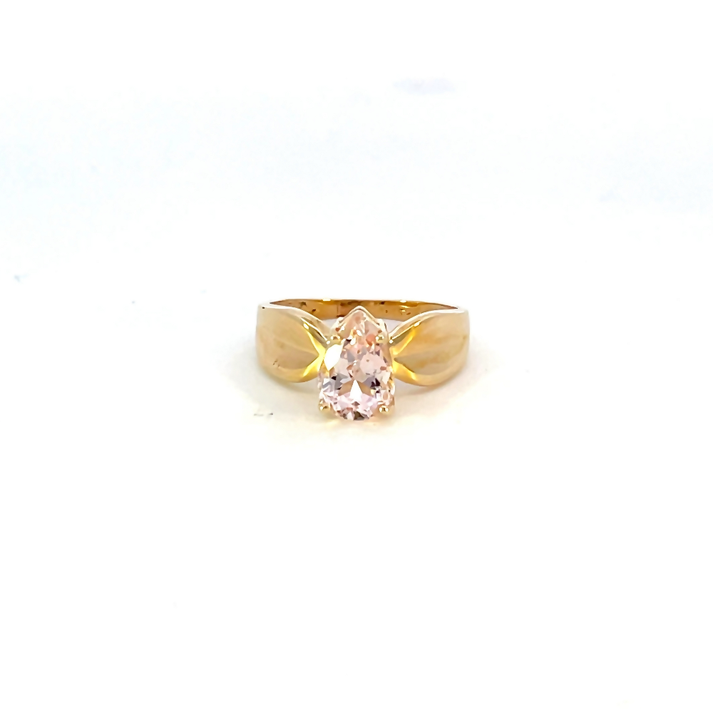 front view of 10 karat yellow gold ring with wide band and pear cut pink center stone