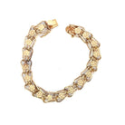 gold open link bracelet with floral design