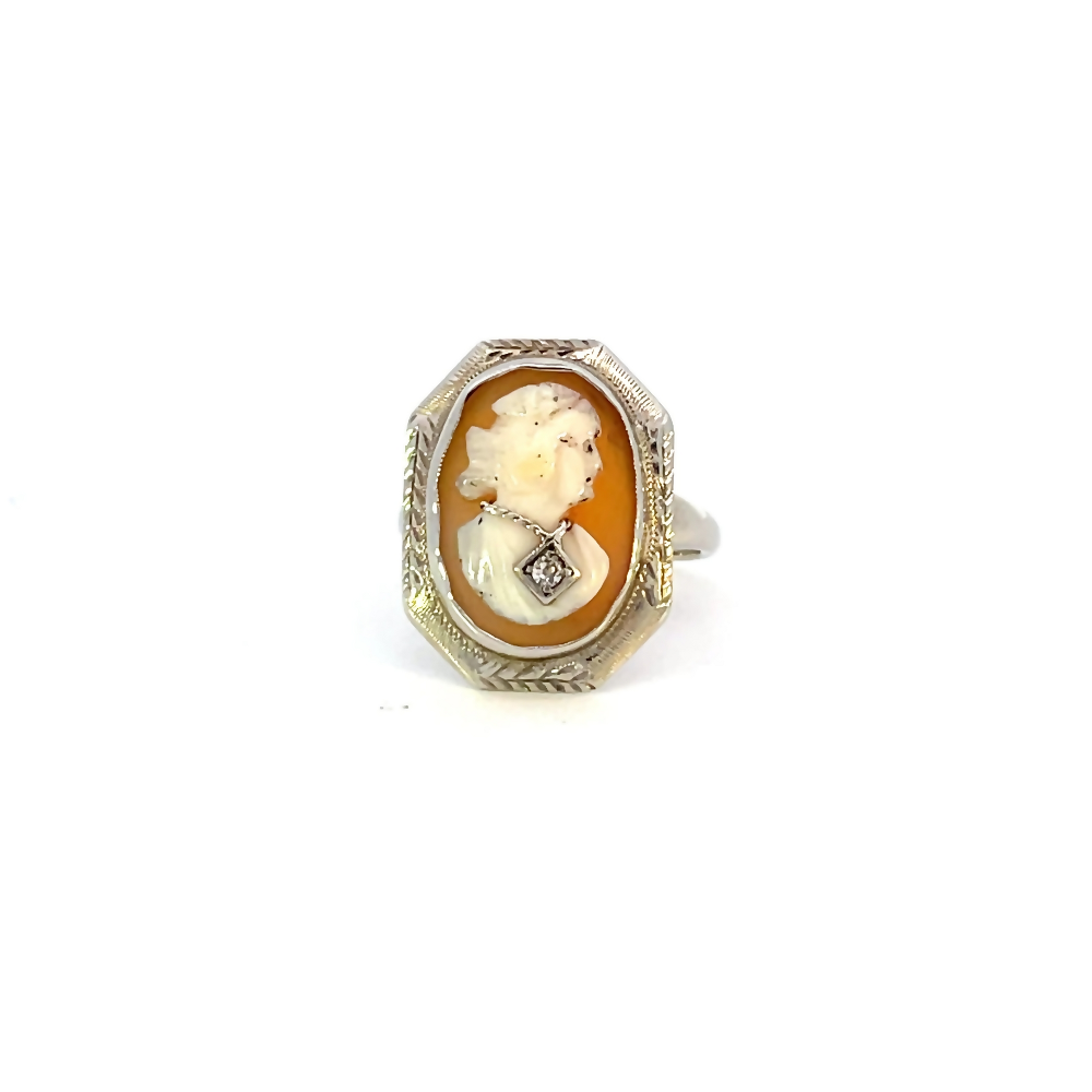front view of 14 karat white gold cameo ring with diamond accent