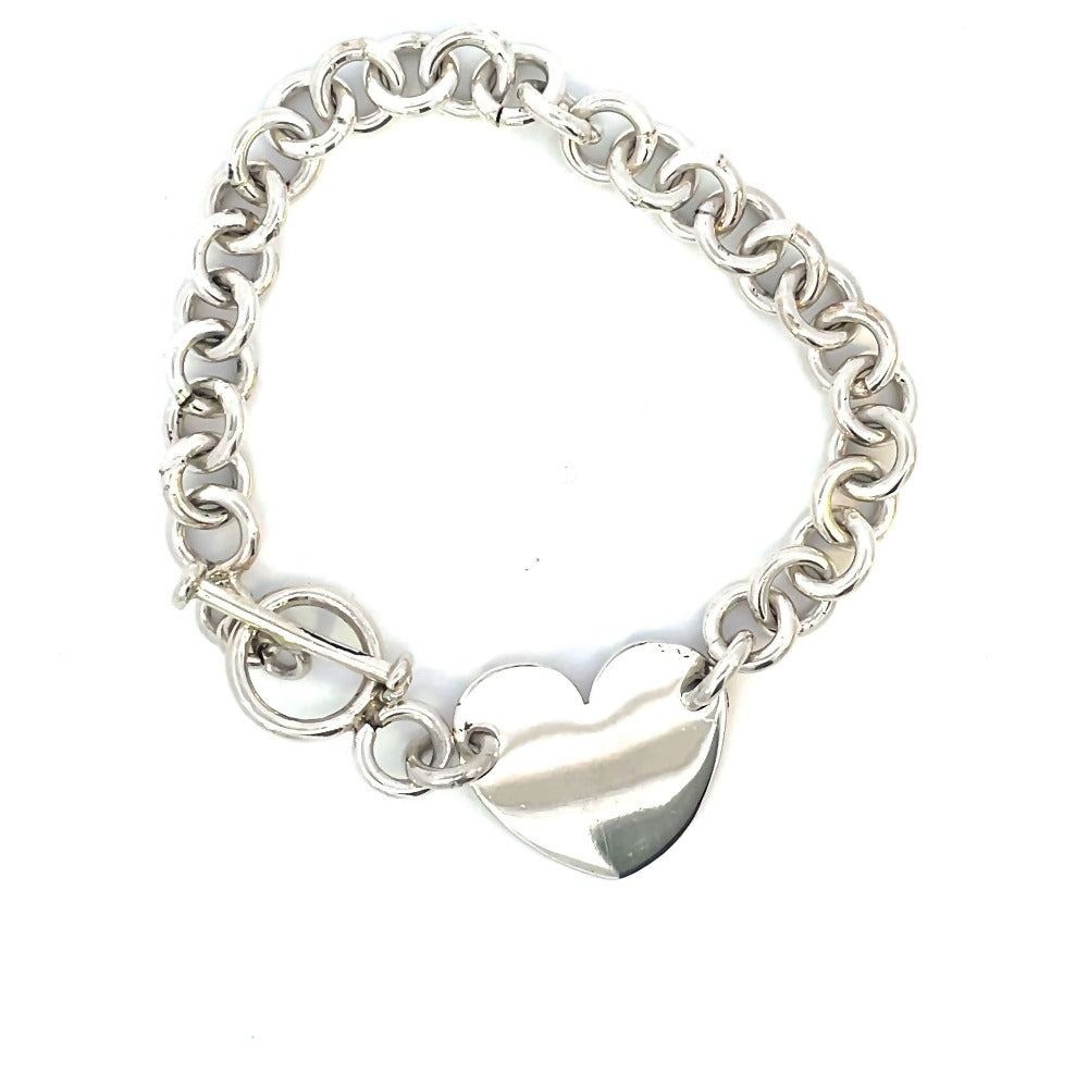 detail view of sterling silver toggle bracelet with heart charm