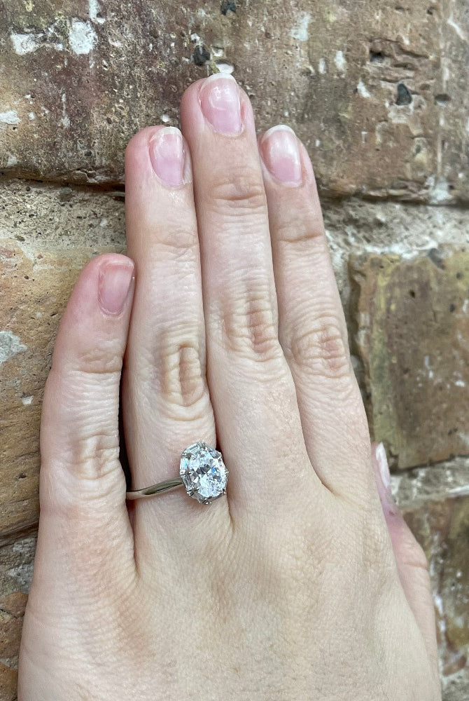14K White Gold Oval Cut Diamond Halo Engagement Ring (Semi-Mount) on hand