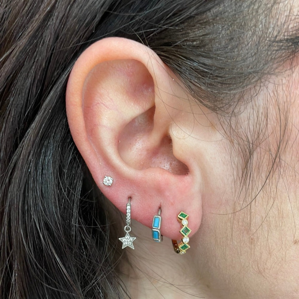 14KY Emerald and Diamond Huggie Hoop Earrings on model