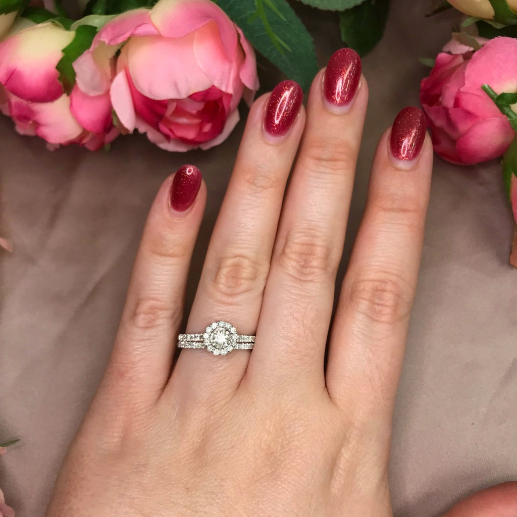 Round Halo Style Engagement Ring with Matching Wedding Band on Model